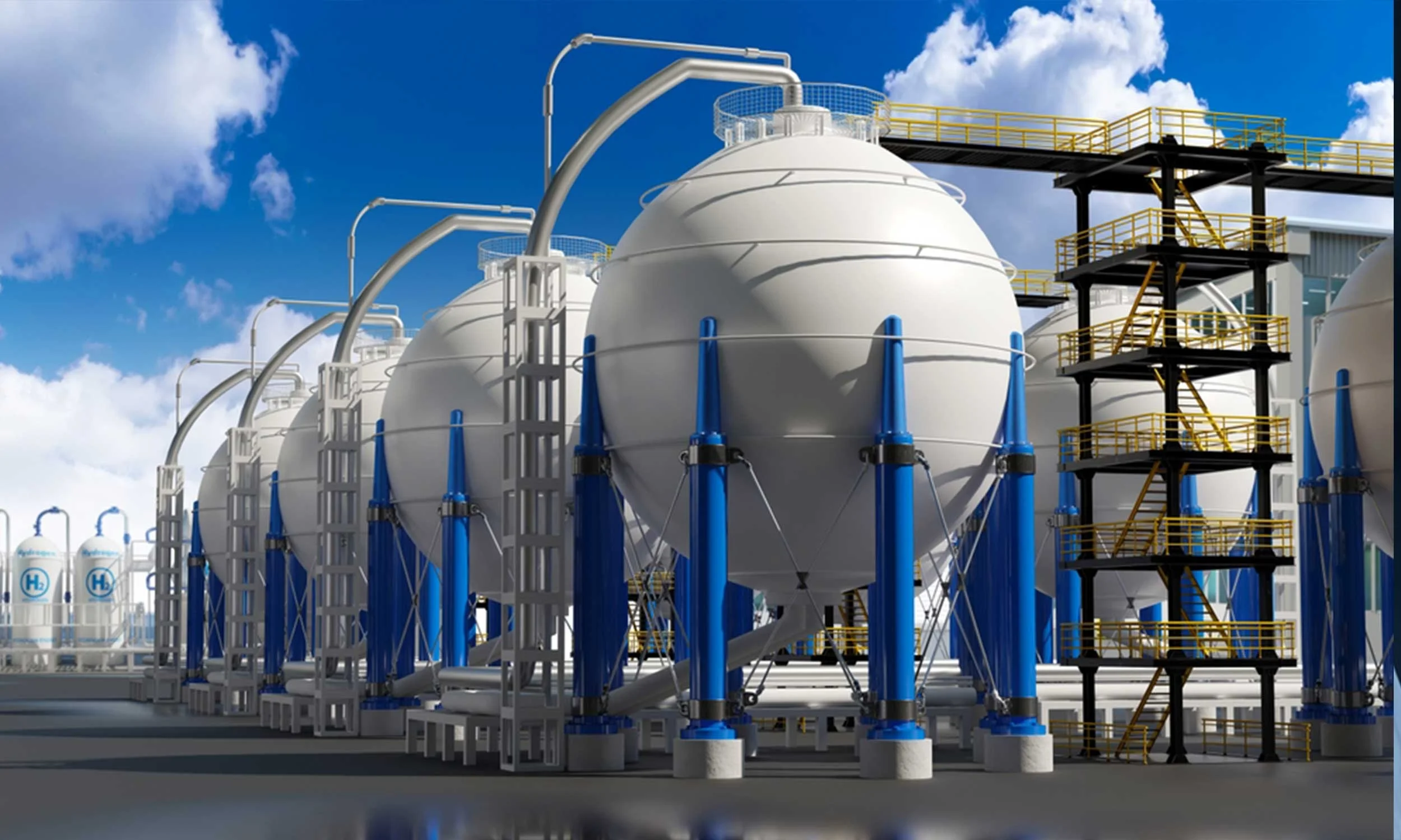 Row of large spherical cryogenic storage tanks with steel piping and support structures