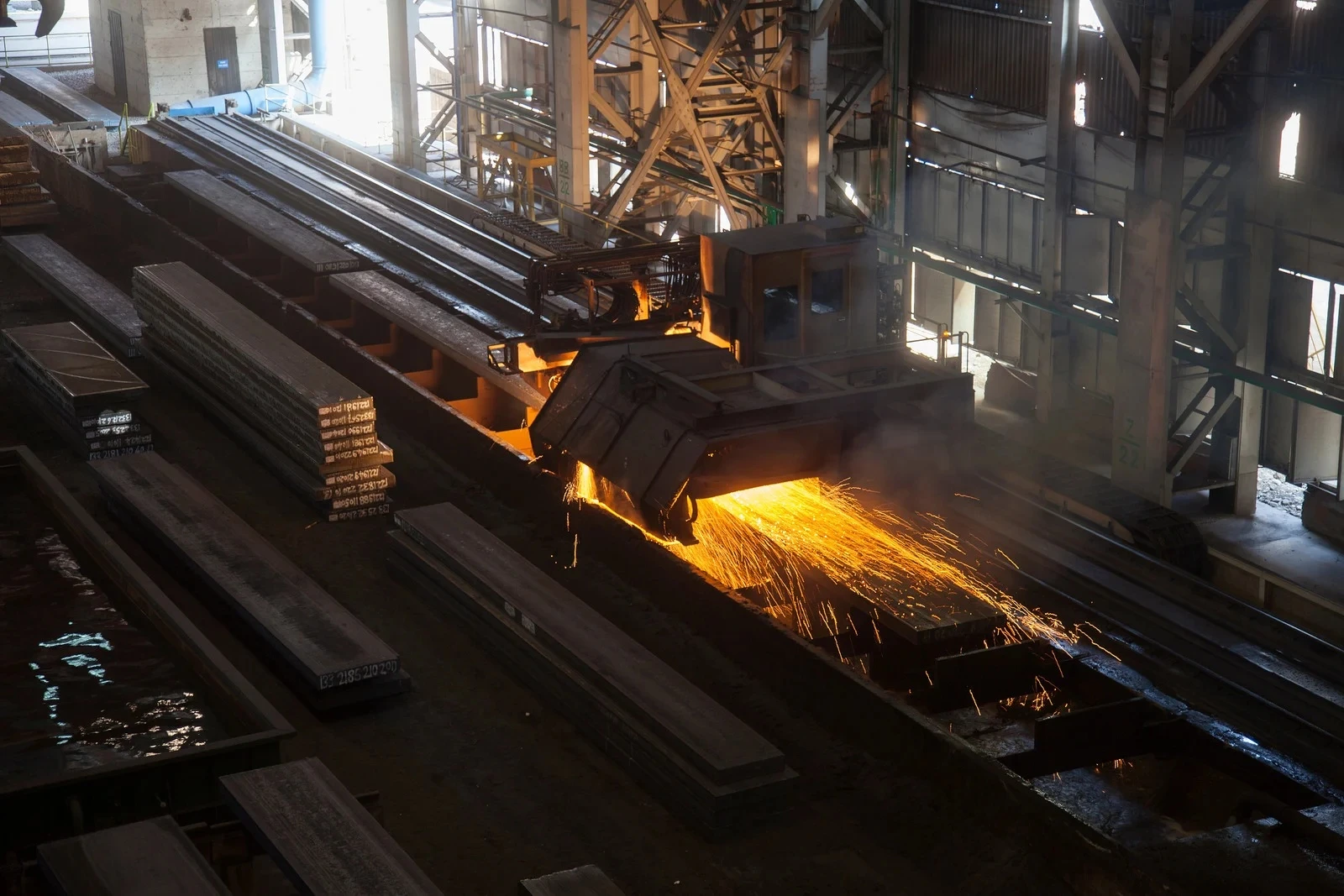 Metal fabrication machine cutting with sparks flying