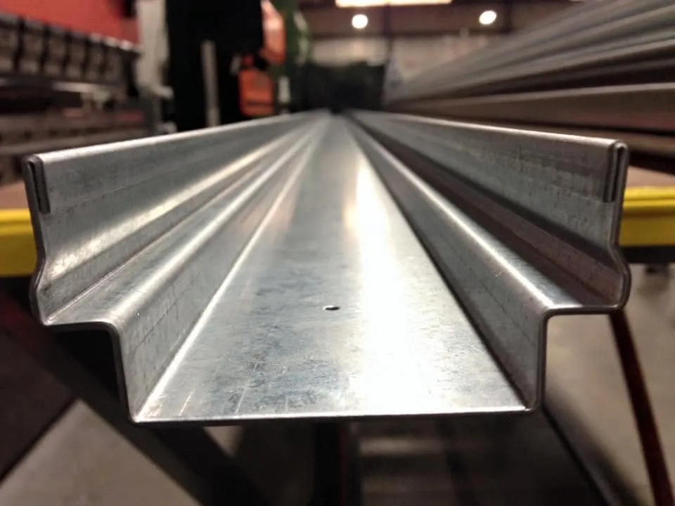 CNC press brake machine bending a sheet metal piece with precision tooling