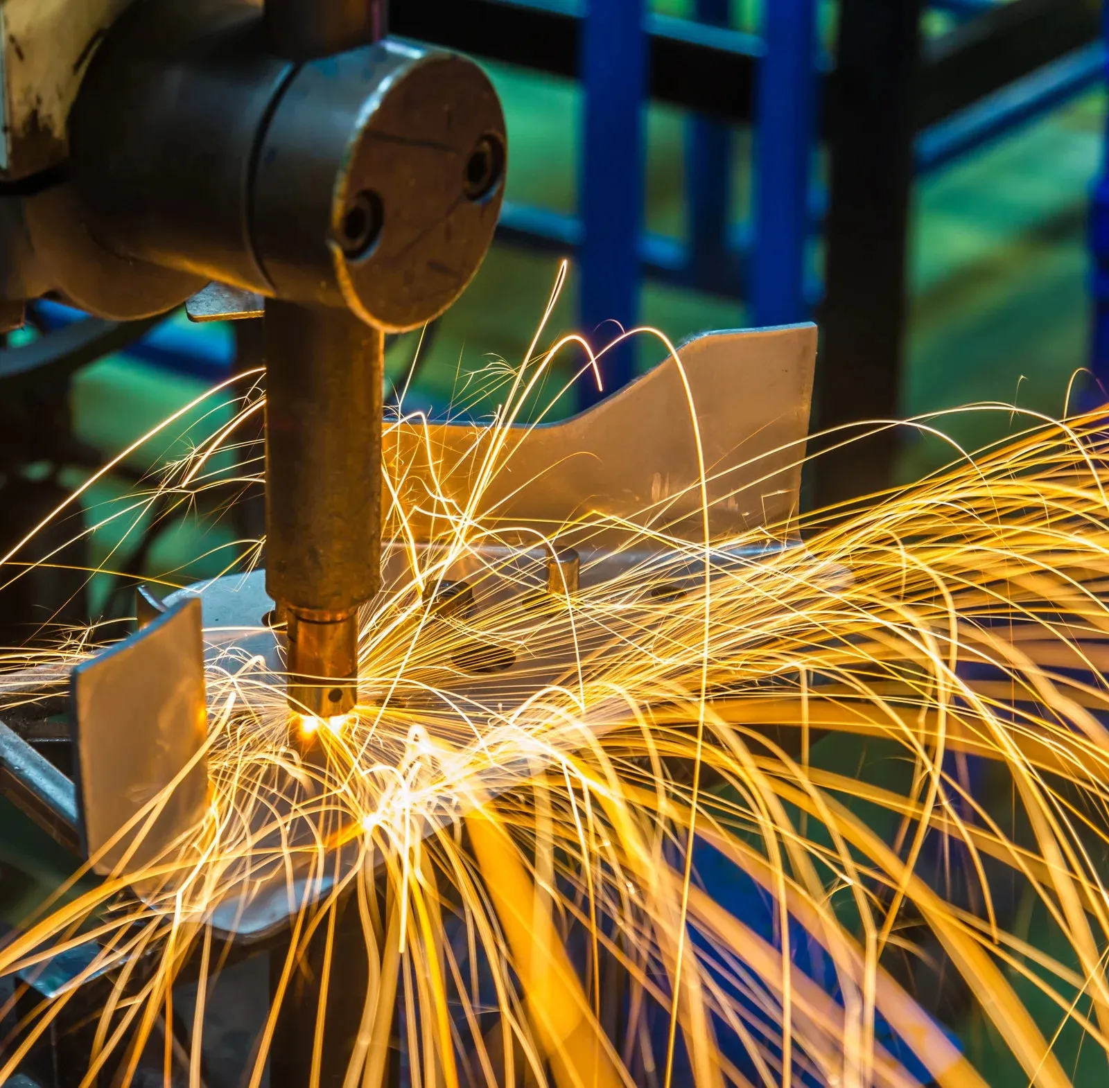 Spot welder producing bright sparks while joining sheet metal