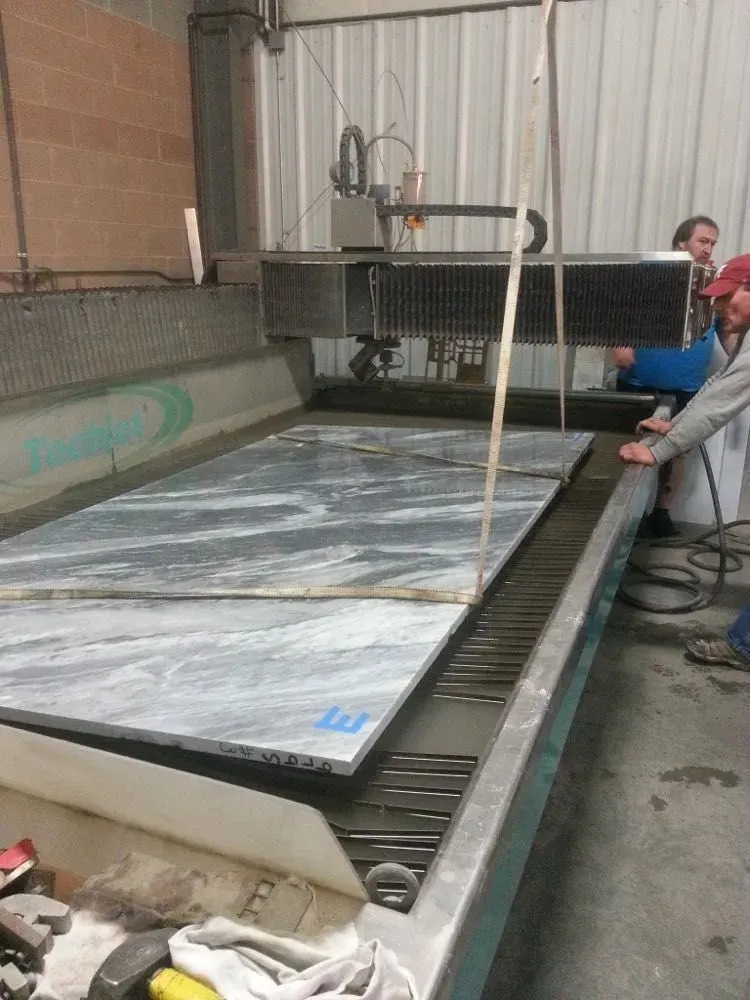 Waterjet machine cutting stone slabs for non-metal fabrication